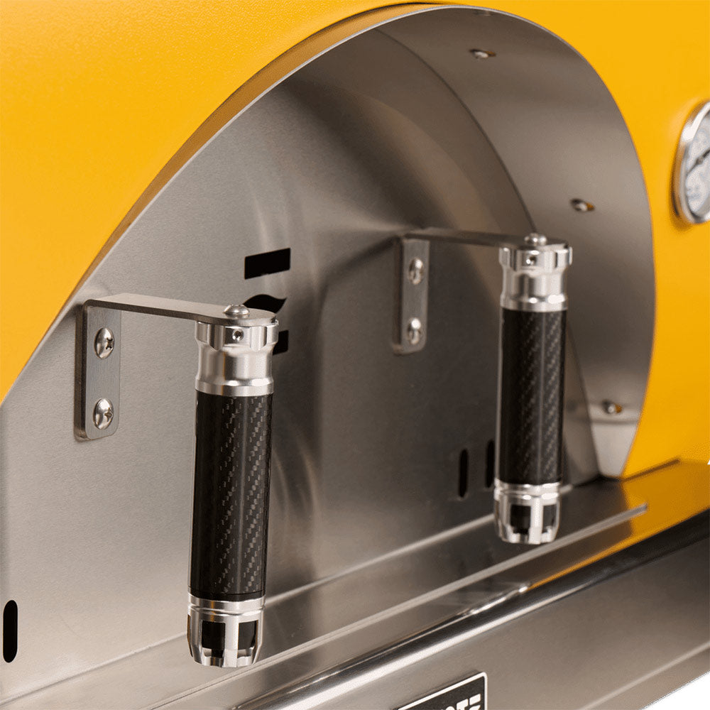 Stainless interior of yellow pizza oven with front controls and knob handles
