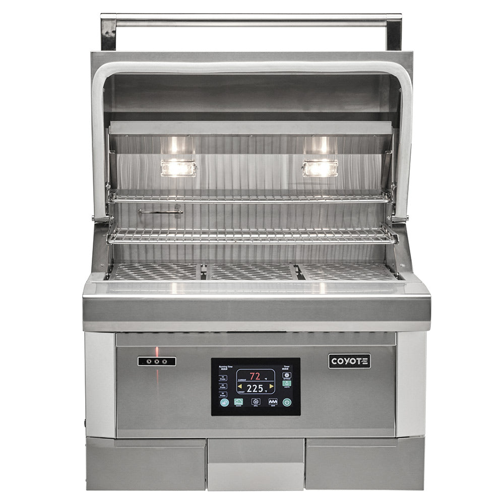 Coyote stainless steel pellet grill with open lid, interior grates, and control panel