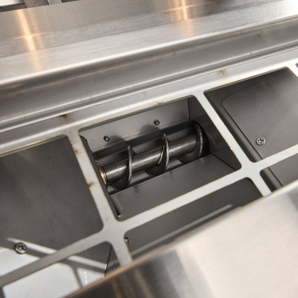 Pellet grill auger feed mechanism inside hopper compartment