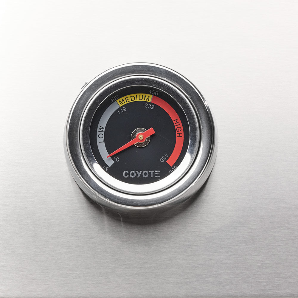 Stainless steel temperature gauge dial with red and yellow scale and Coyote marking
