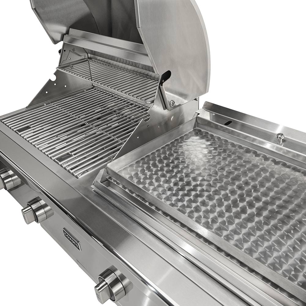 Stainless steel flat top and grill grates inside open lid, close-up