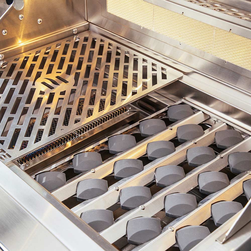 Gas grill burners and cooking grid inside stainless steel firebox