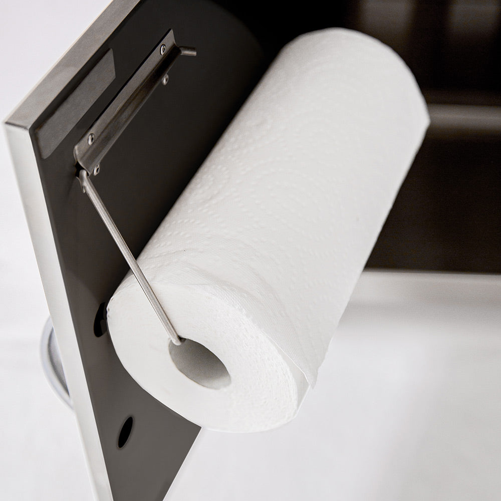 Toilet paper roll in holder on side of grill cart