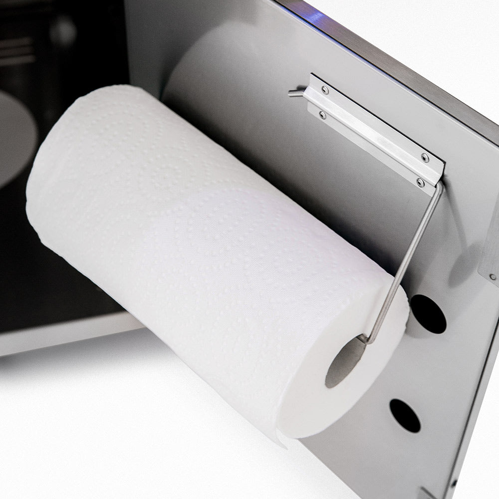 Toilet paper holder on grill cart side panel, white frame with spring arm