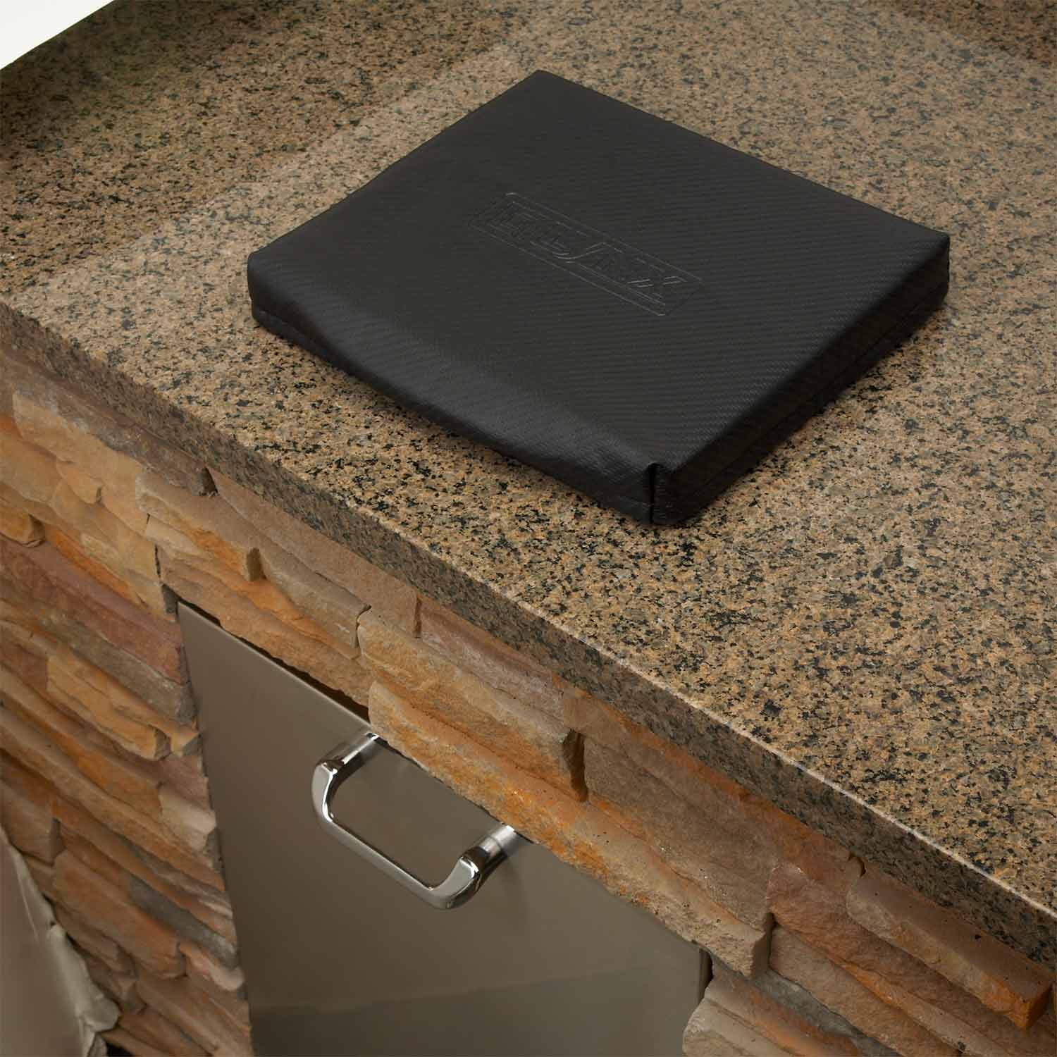 Carbon fiber vinyl trash chute cover, black square over chute opening