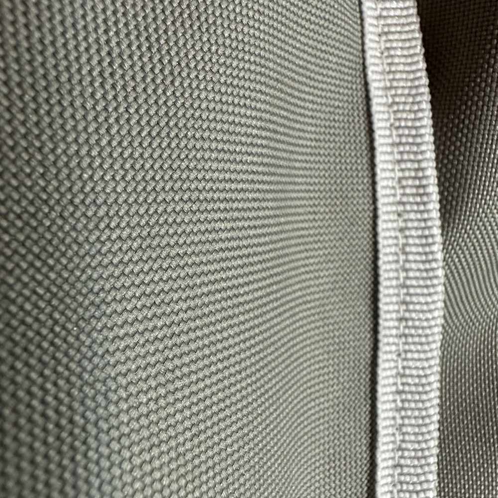 Light gray vinyl grill cover edge with textured fabric and stitched trim