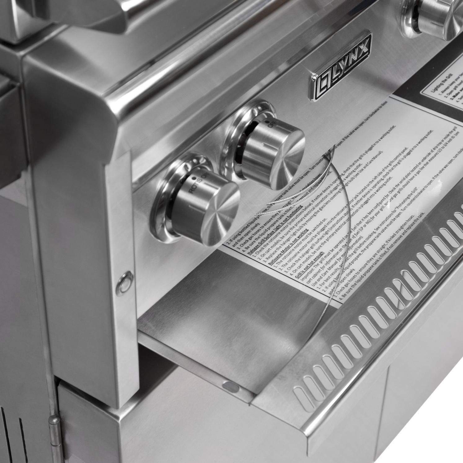 Built-in gas grill control knob area with instruction label and stainless control panel