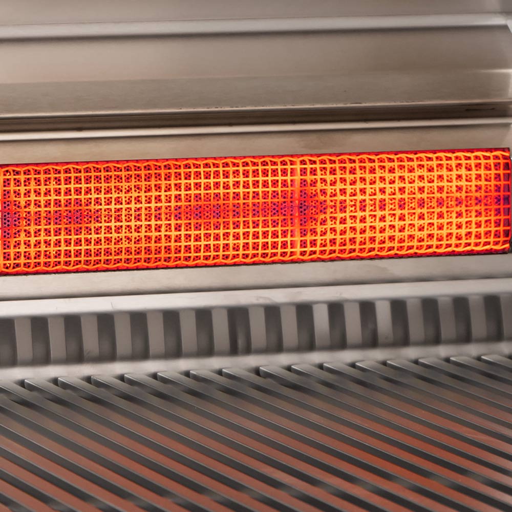 Gas grill burner with red-orange mesh flame panel under the cooking grate