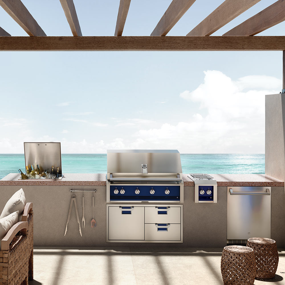 Built-in gas grill with control panel, knobs, and cabinet doors