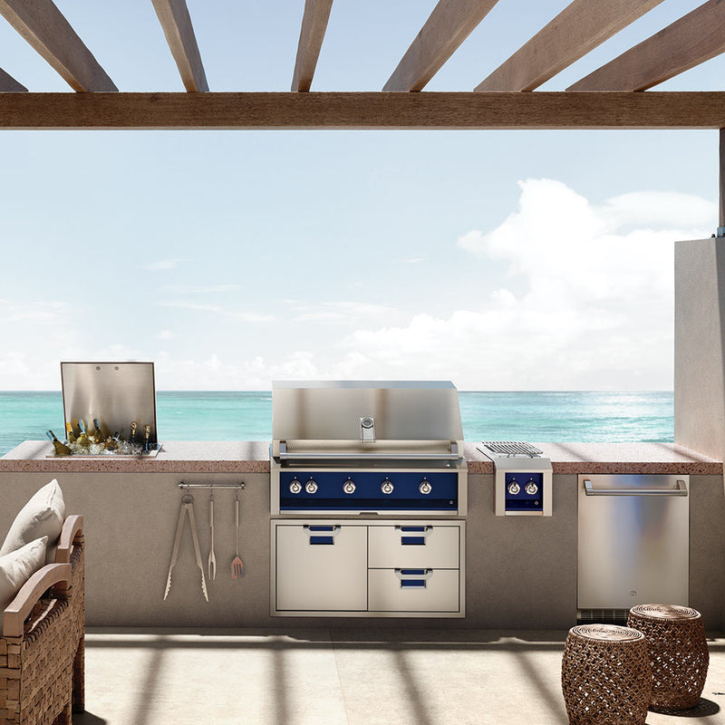 Built-in gas grill with control panel, knobs, and cabinet doors