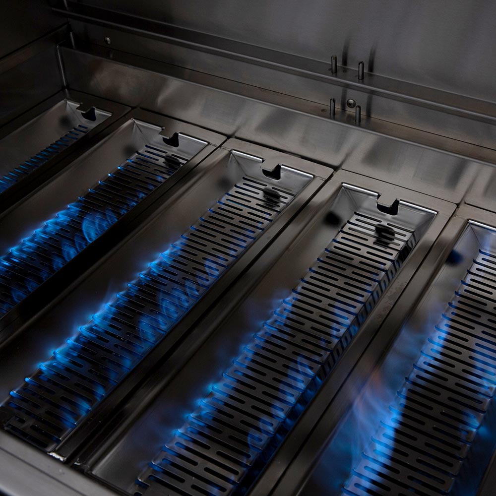 Built-in dual fuel grill with blue flames across stainless burner bars
