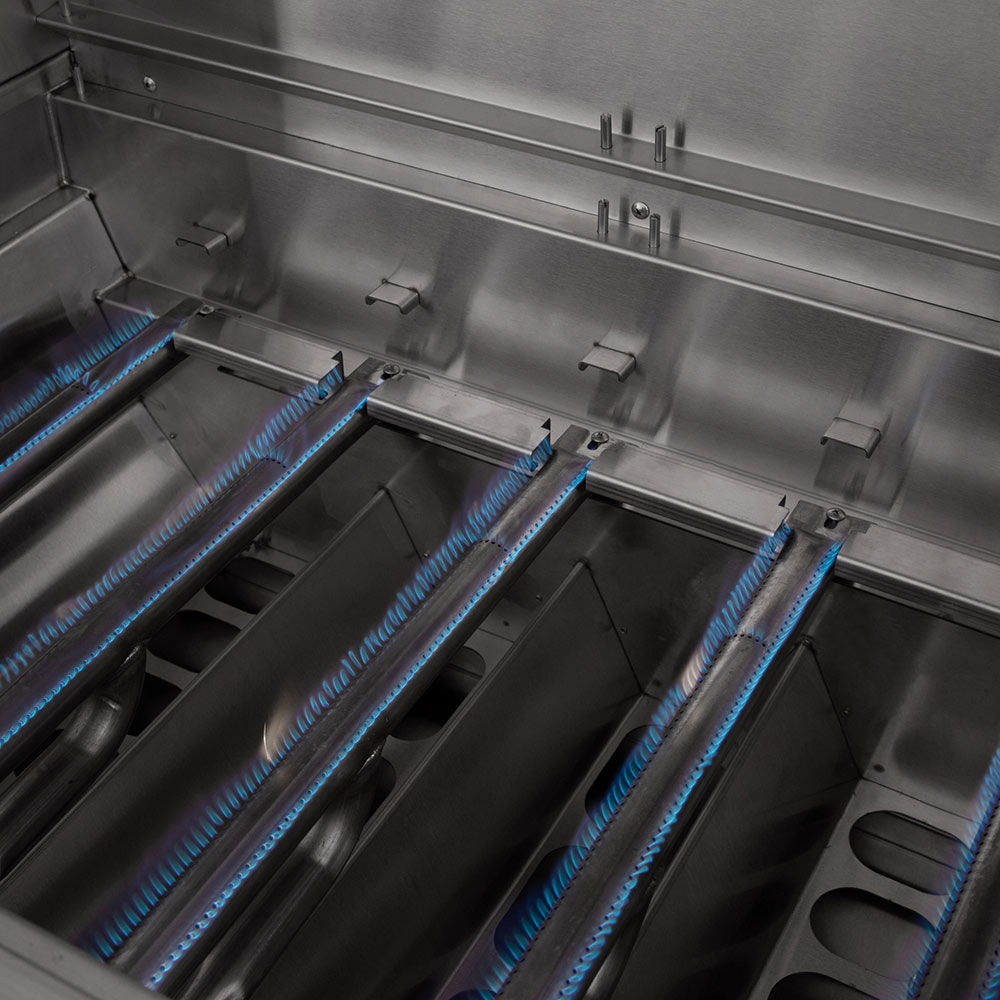 Built-in dual fuel grill interior with blue flame lines across burner tubes