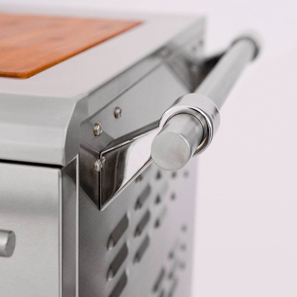 Rotisserie control knob and side panel on a stainless dual fuel grill.