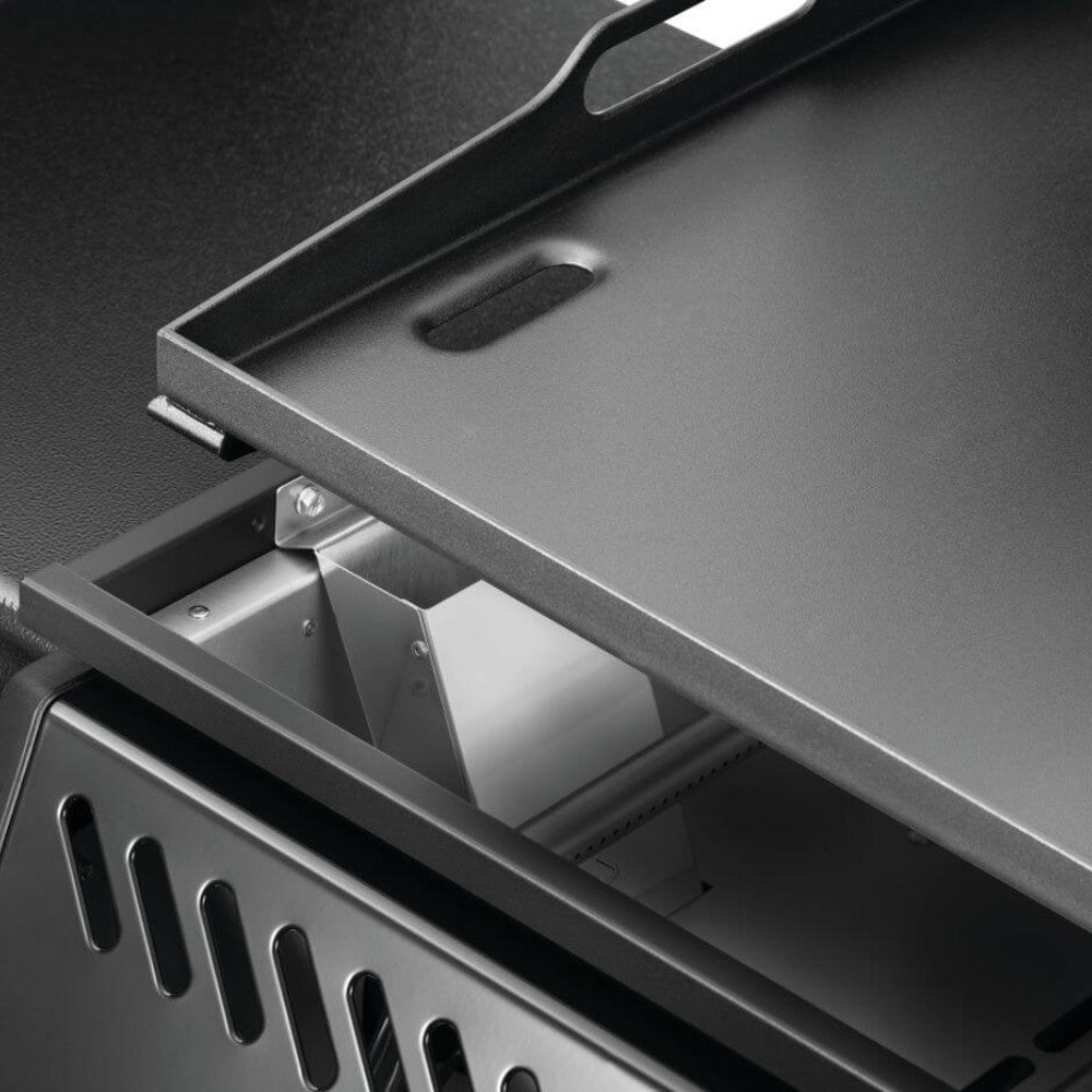 Open griddle hood with vented interior panel above the preheated cooking surface
