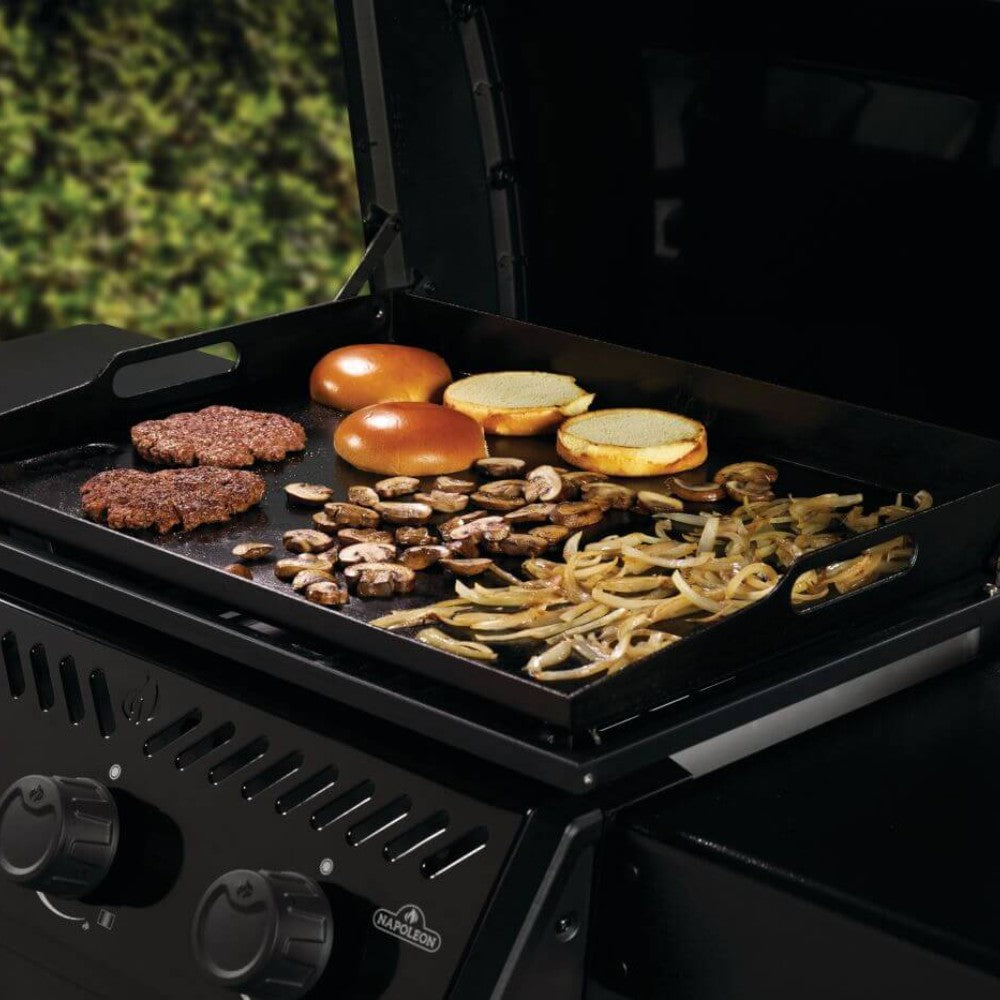 Gas griddle cart with burgers, sausages, and onions cooking on the griddle