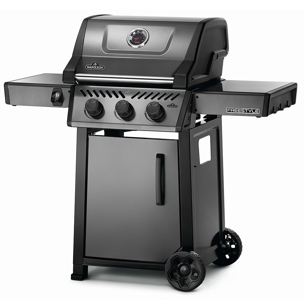 Gas grill on cart with closed lid, control panel knobs, and side shelf