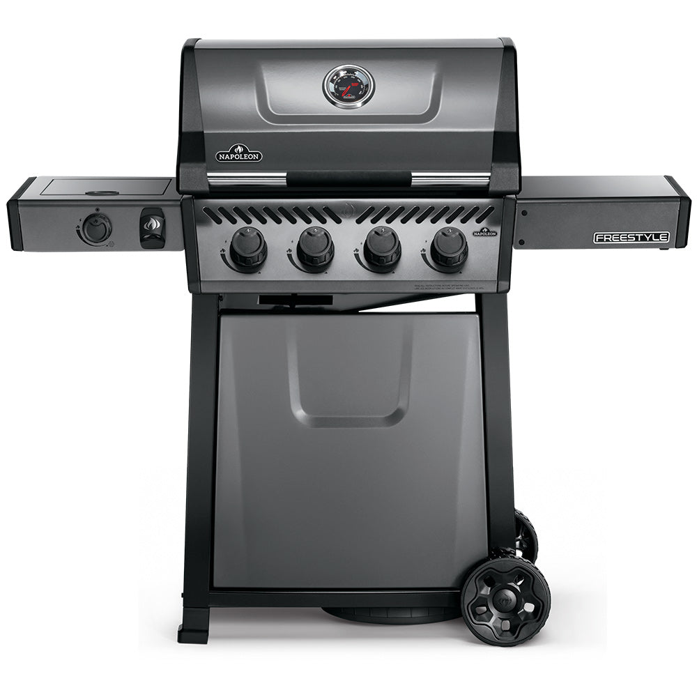 Gas grill with closed lid, front control knobs, and side range burner on a cart