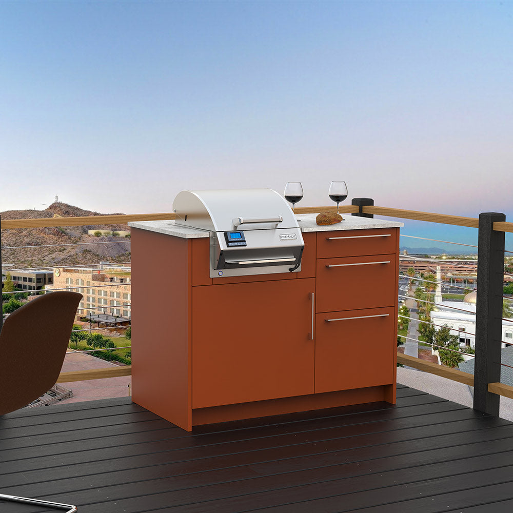 Built-in electric grill with closed lid and control panel on orange base cabinet