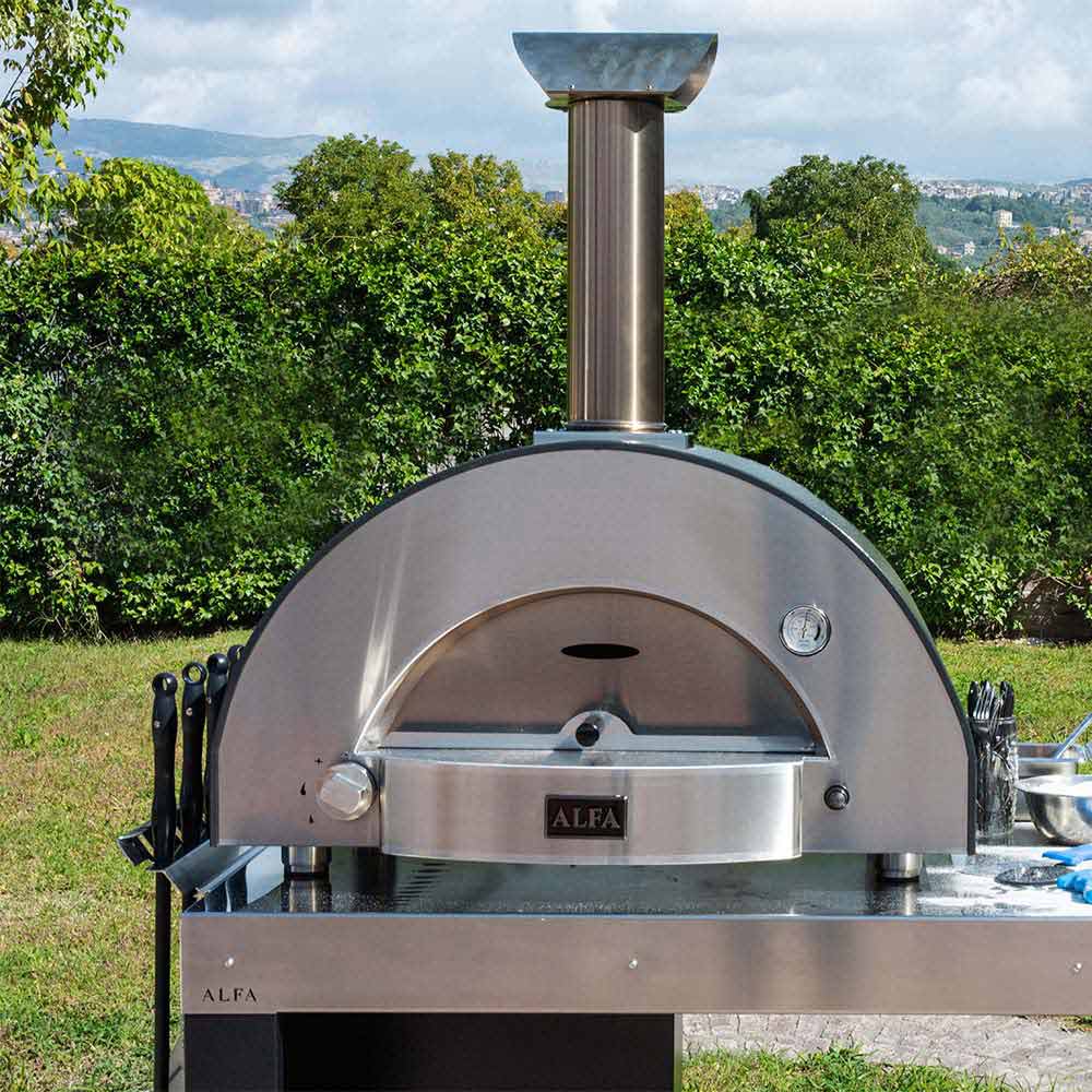 Wood-fired pizza oven on outdoor station with dome opening and chimney