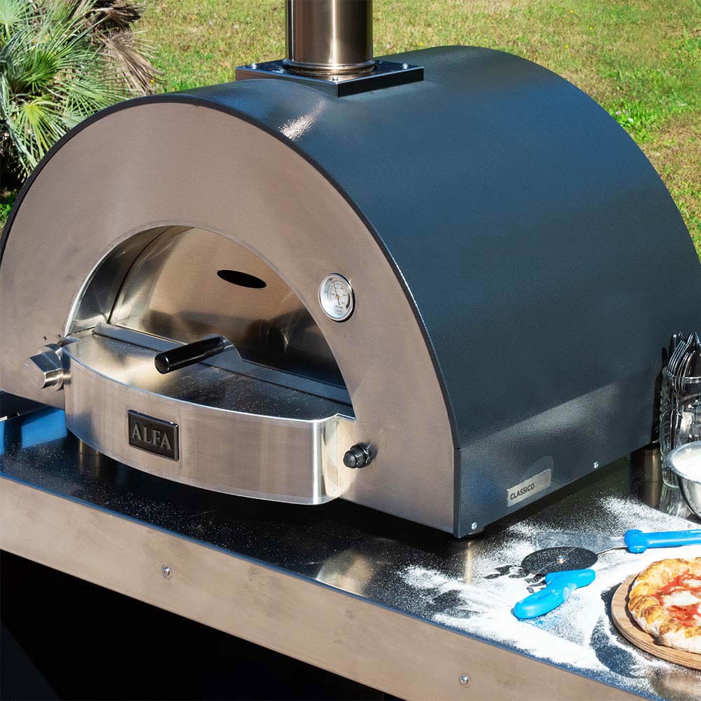 Outdoor wood-fired pizza oven with arched door, chimney, and side knob