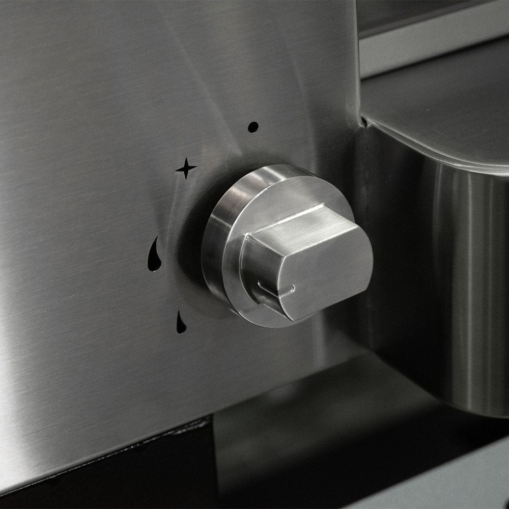 Gas pizza oven side control knob on stainless housing near the chamber opening