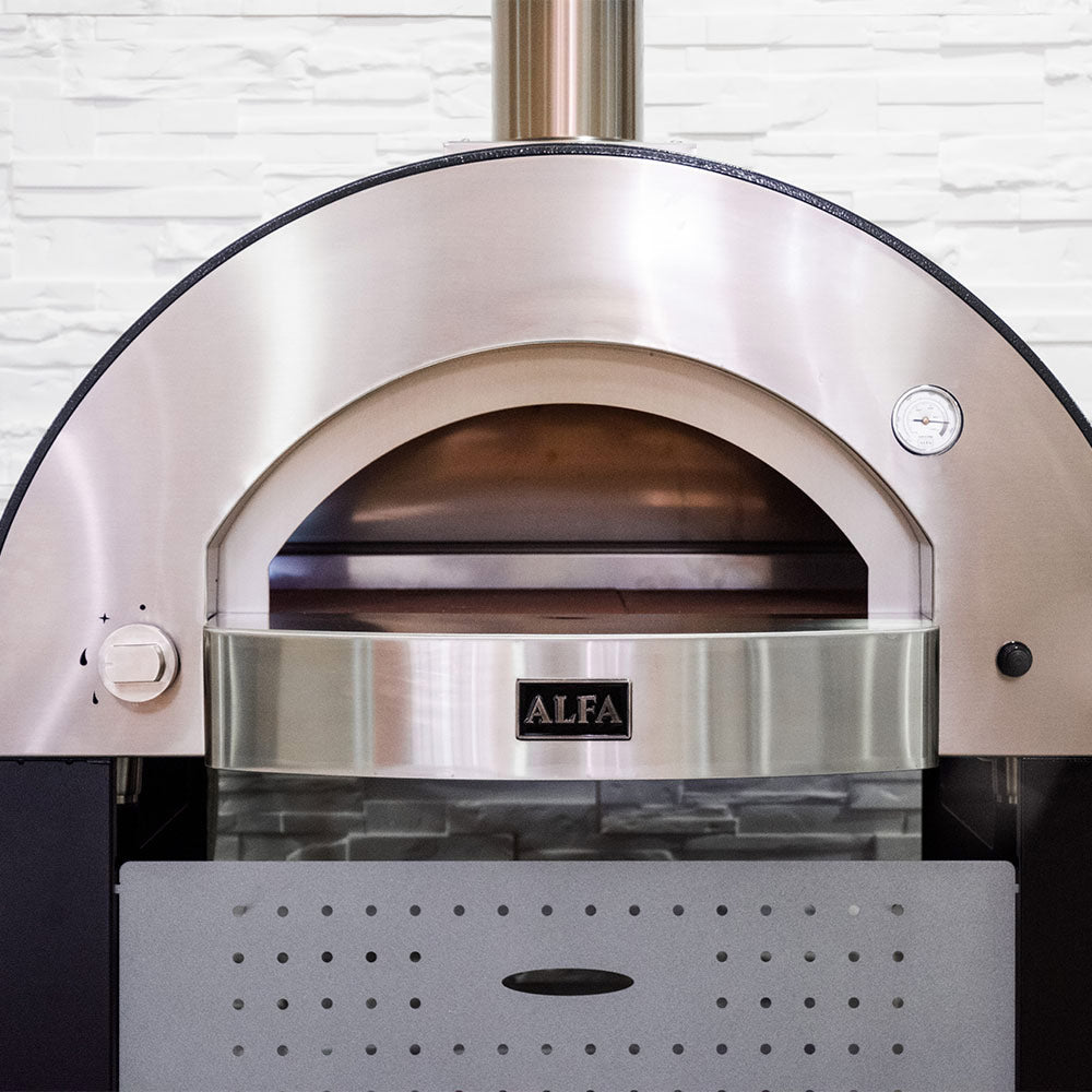 Gas pizza oven front view with open baking chamber, stainless shelf, and gauge