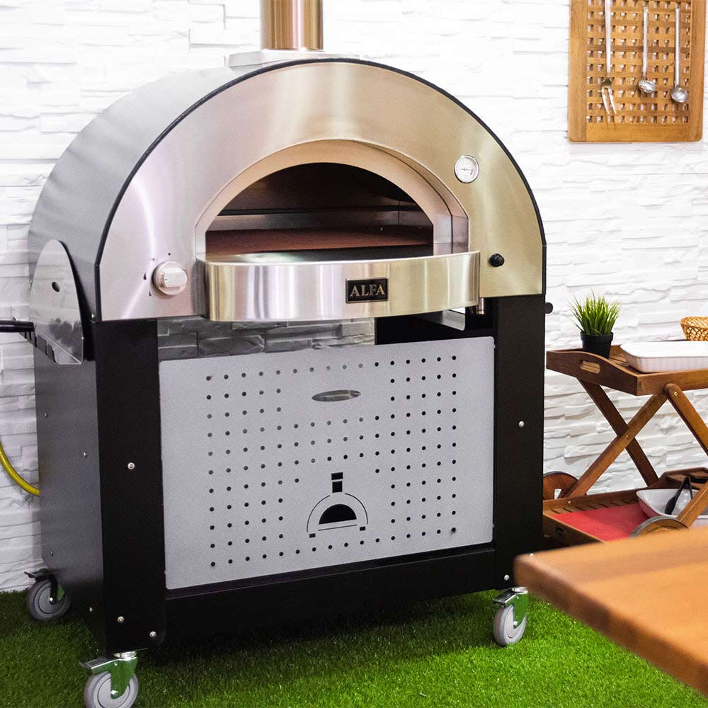 Freestanding gas pizza oven with open front chamber and stainless baking tray on wheels