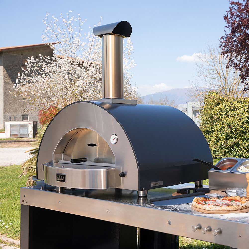 Alfa Classico 4 countertop gas pizza oven outdoors, stainless oven front and chimney