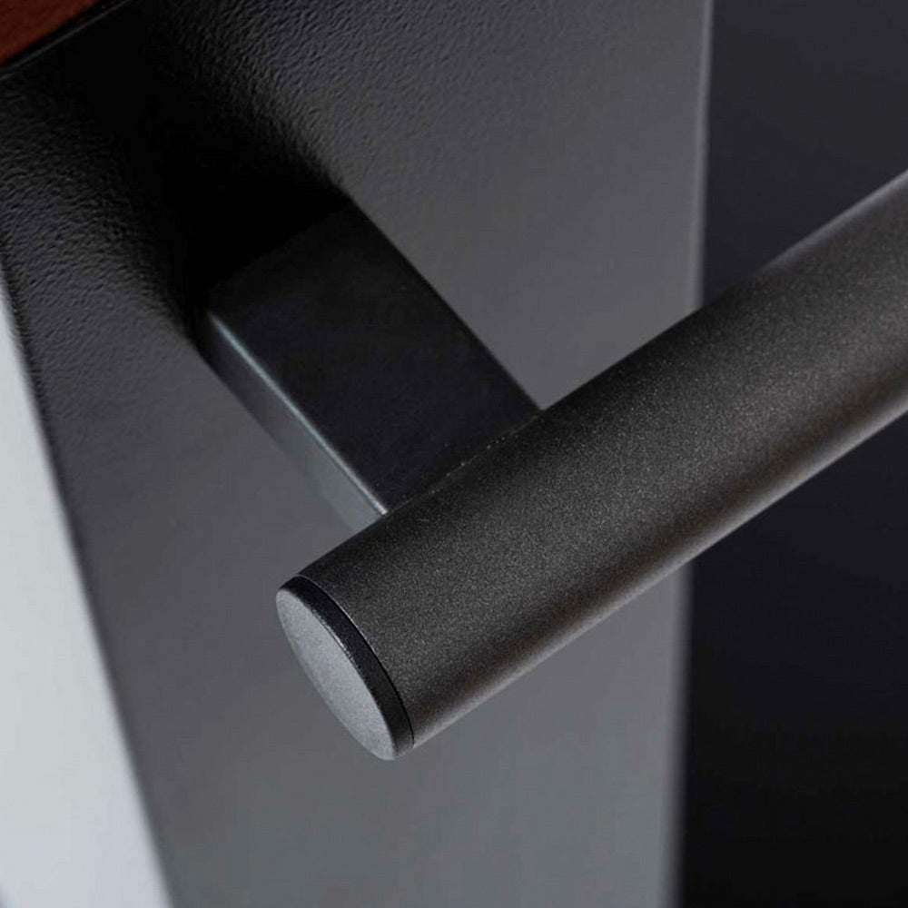Black gas pizza oven burner tube close-up with curved stainless channel