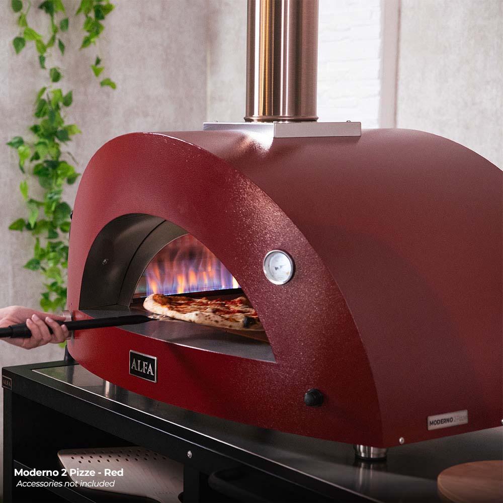 Red pizza oven dome with side opening, glowing flame and pizza on stone