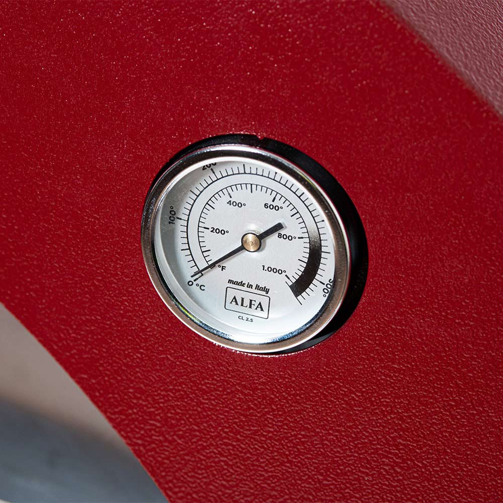Temperature gauge on ruby red gas pizza oven front