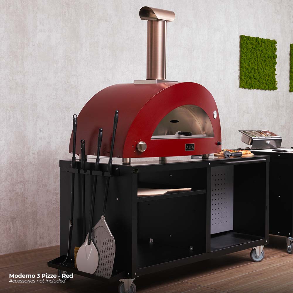 Red wood-fired pizza oven with chimney and hanging tools on the black side panel