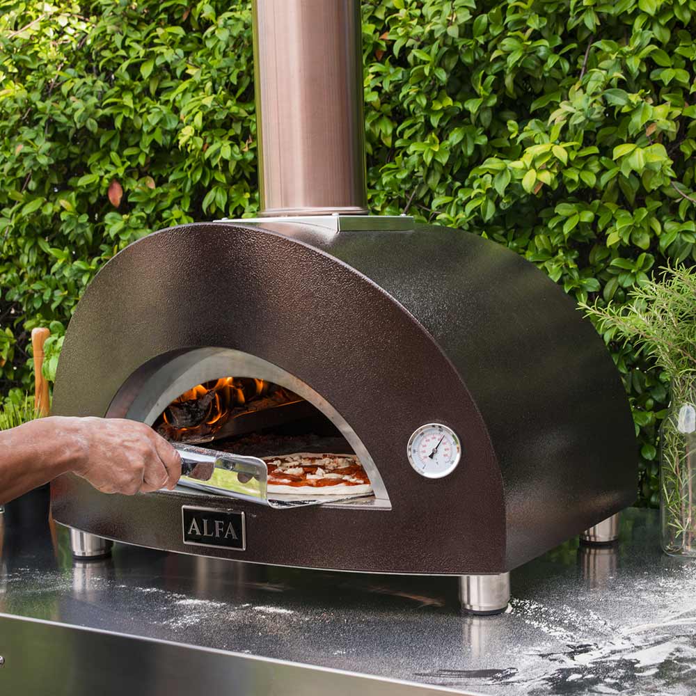 Wood-fired pizza oven with open door, flames glowing behind the hearth