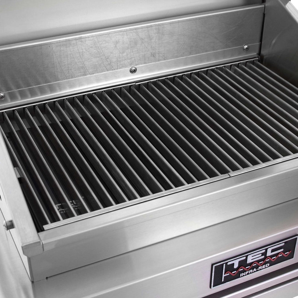 Stainless steel grill interior with black ridged cooking grates, open lid
