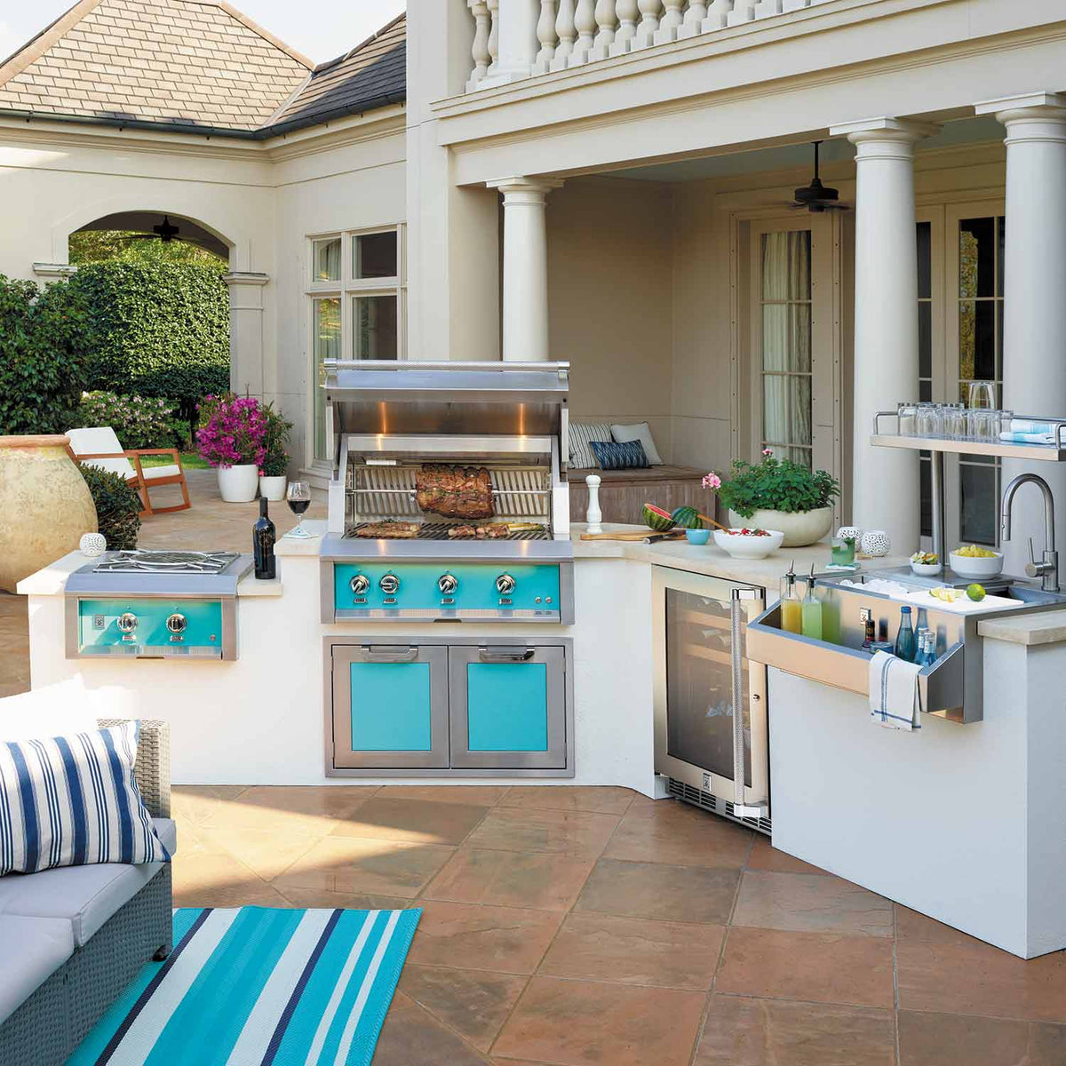 Outdoor built-in gas grill in stainless with multi-knob control panel and side storage