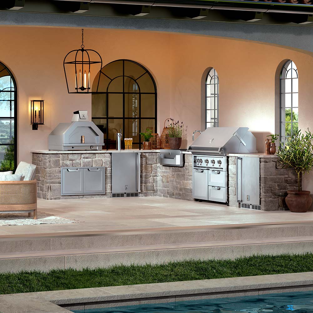 Built-in stainless steel gas grill with two side burners and control knobs