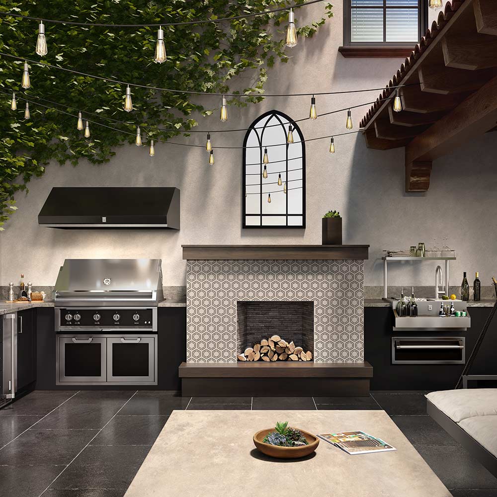 Built-in outdoor gas grill with hood, multiple burner controls, and side cabinet doors