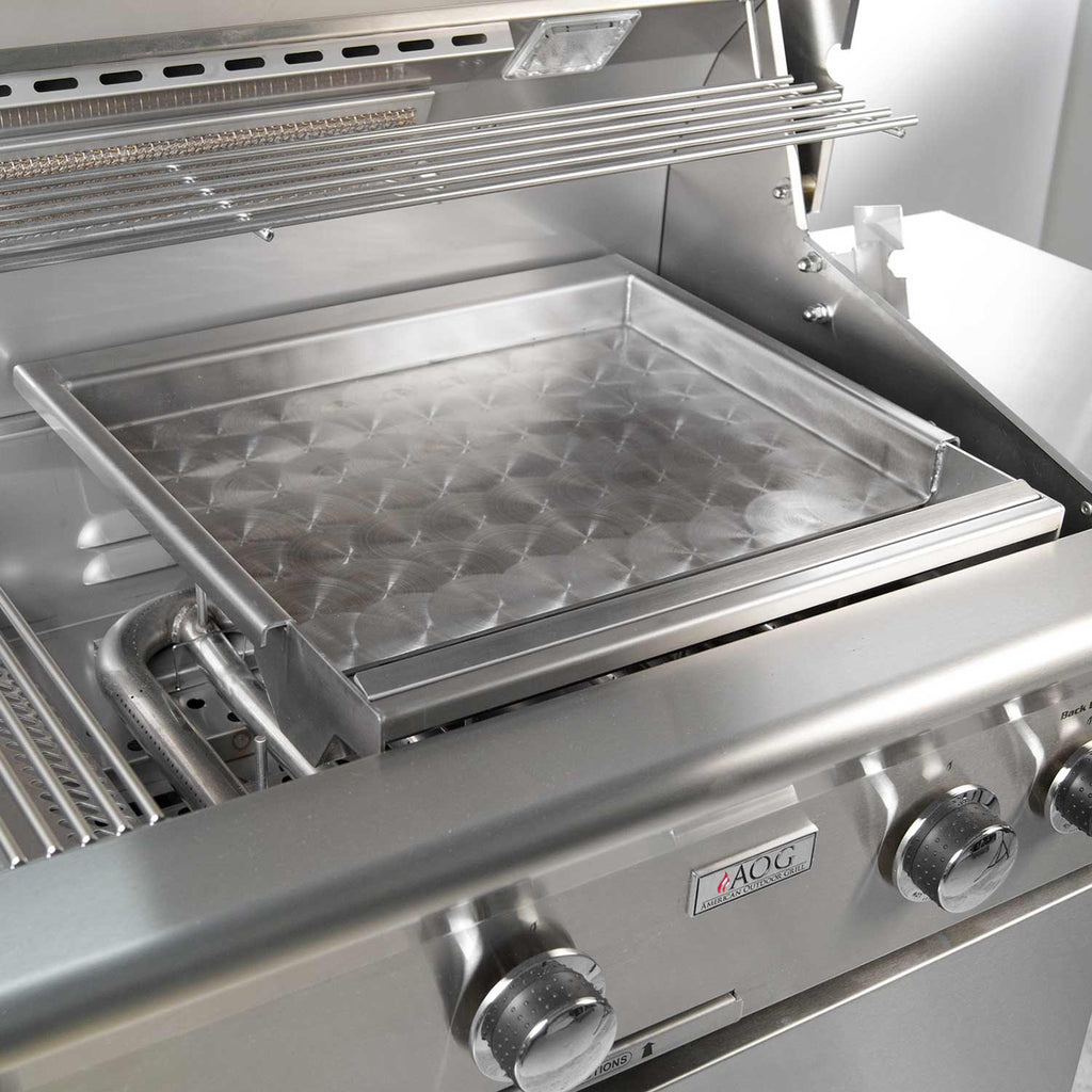 Stainless steel griddle insert with diamond-textured cooking surface in outdoor grill