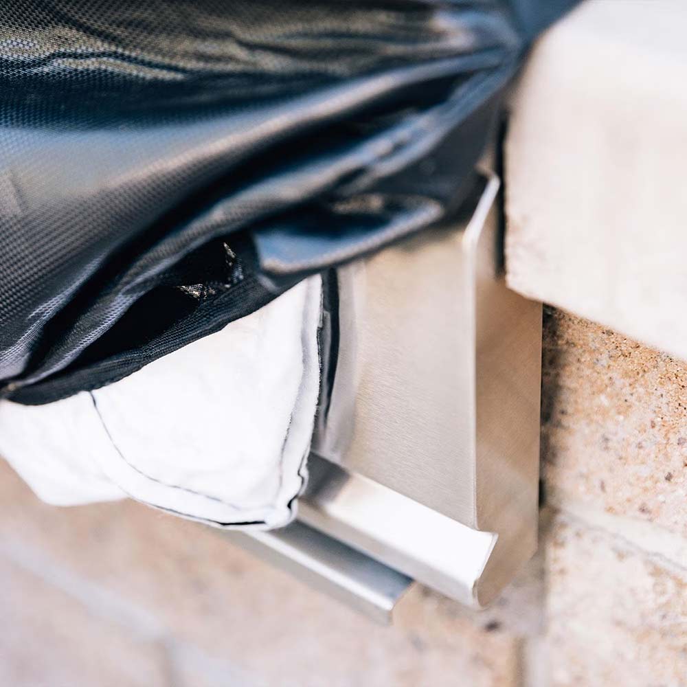 Grill cover corner with adjustable strap and elastic hem, dark fabric