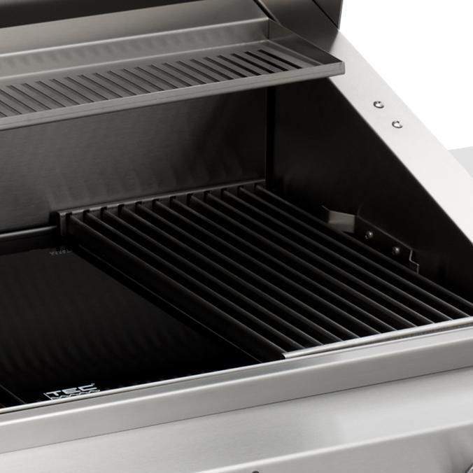 Infrared gas grill interior with black cooking grates and open hood