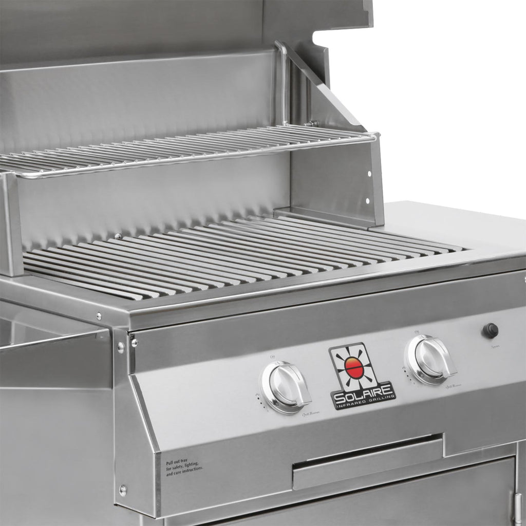 Open stainless Solaire grill lid with lower grate and front burner control area