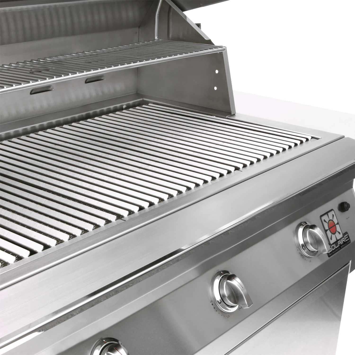 Stainless steel grill cooking grates with open hood panel and control knobs on front.