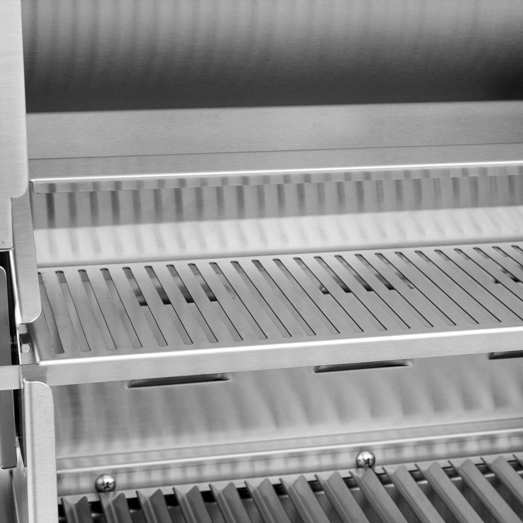 Stainless built-in grill burner area with ridged heat shields and grate bars