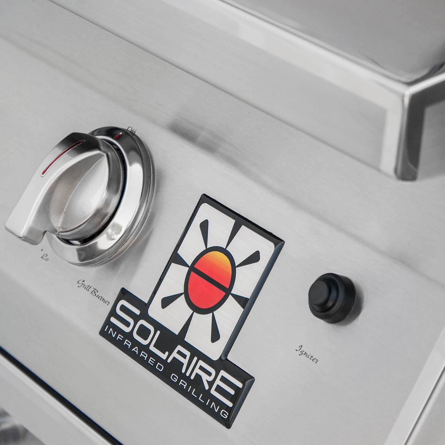 Stainless grill control panel with knobs and Solaire infrared branding