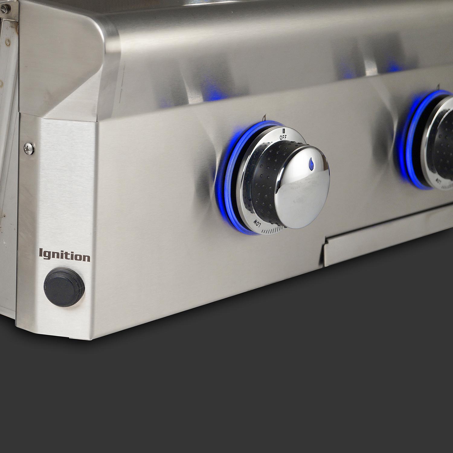 Stainless grill control panel with blue-ring knobs and ignition button