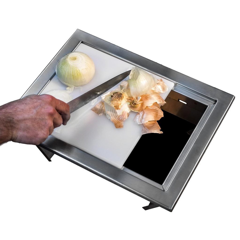 Stainless steel trash chute with open lid; hand drops onion and food waste