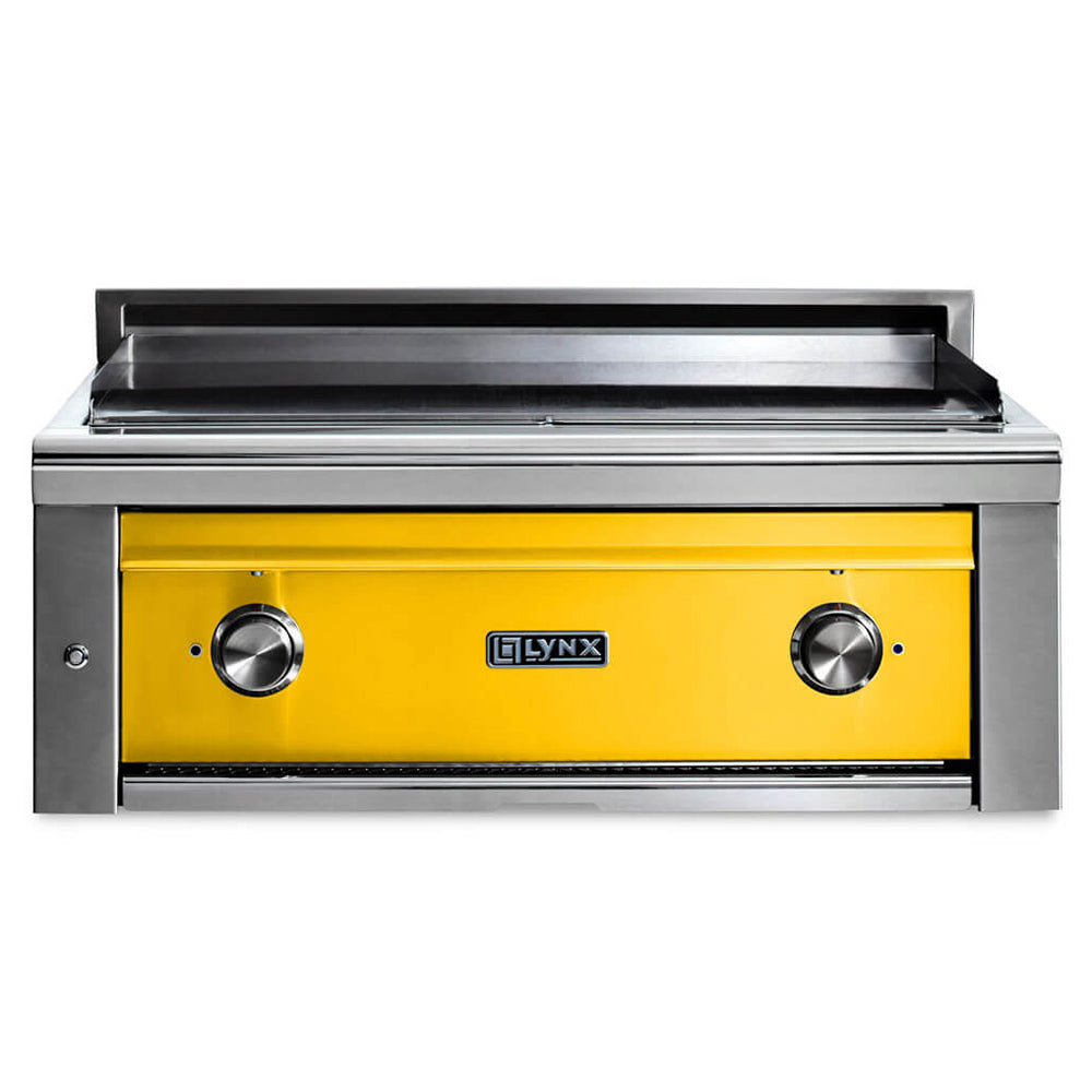 Built-in flat top gas grill with yellow front panel and two stainless control knobs