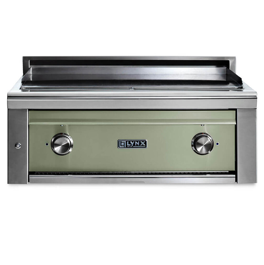 Built-in flat top gas grill with light green front panel and two stainless control knobs