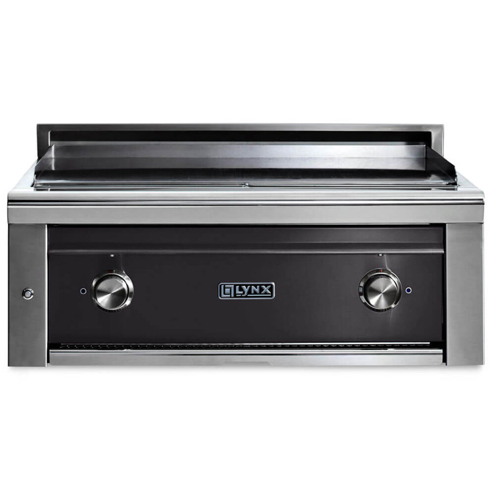 Built-in flat top gas grill with dark front panel and two stainless control knobs