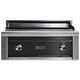 Built-in flat top gas grill with dark front panel and two stainless control knobs